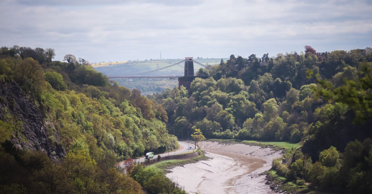 A scenic view of the Clifton Suspension Bridge spanning the Avon Gorge in Bristol, England.